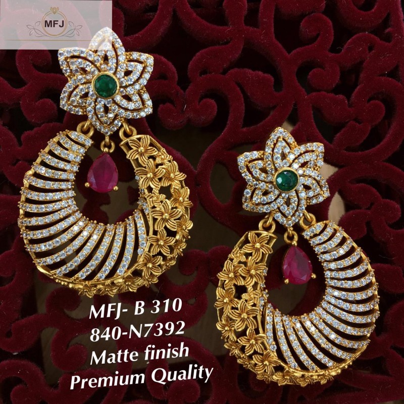 Stylish Grey colour carved stone earrings with Kundan and Pearl detailing.  Dangle Grey earrings with push backs